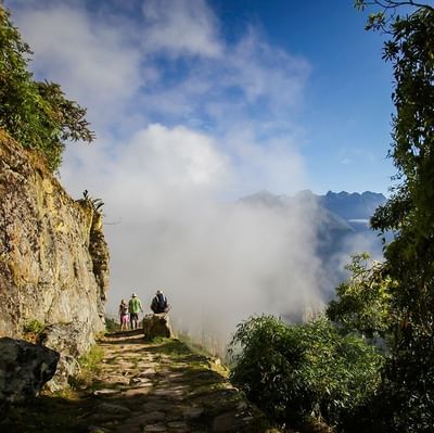Tourists going on a hike on a mountain near Hotel Sumaq
