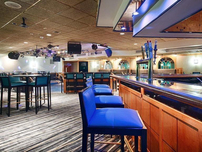 bar with stools and high top seating