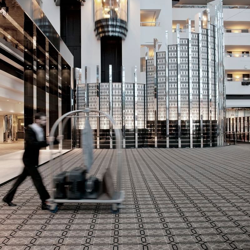 Housekeeper pushing a trolley at Crown Metropol Perth