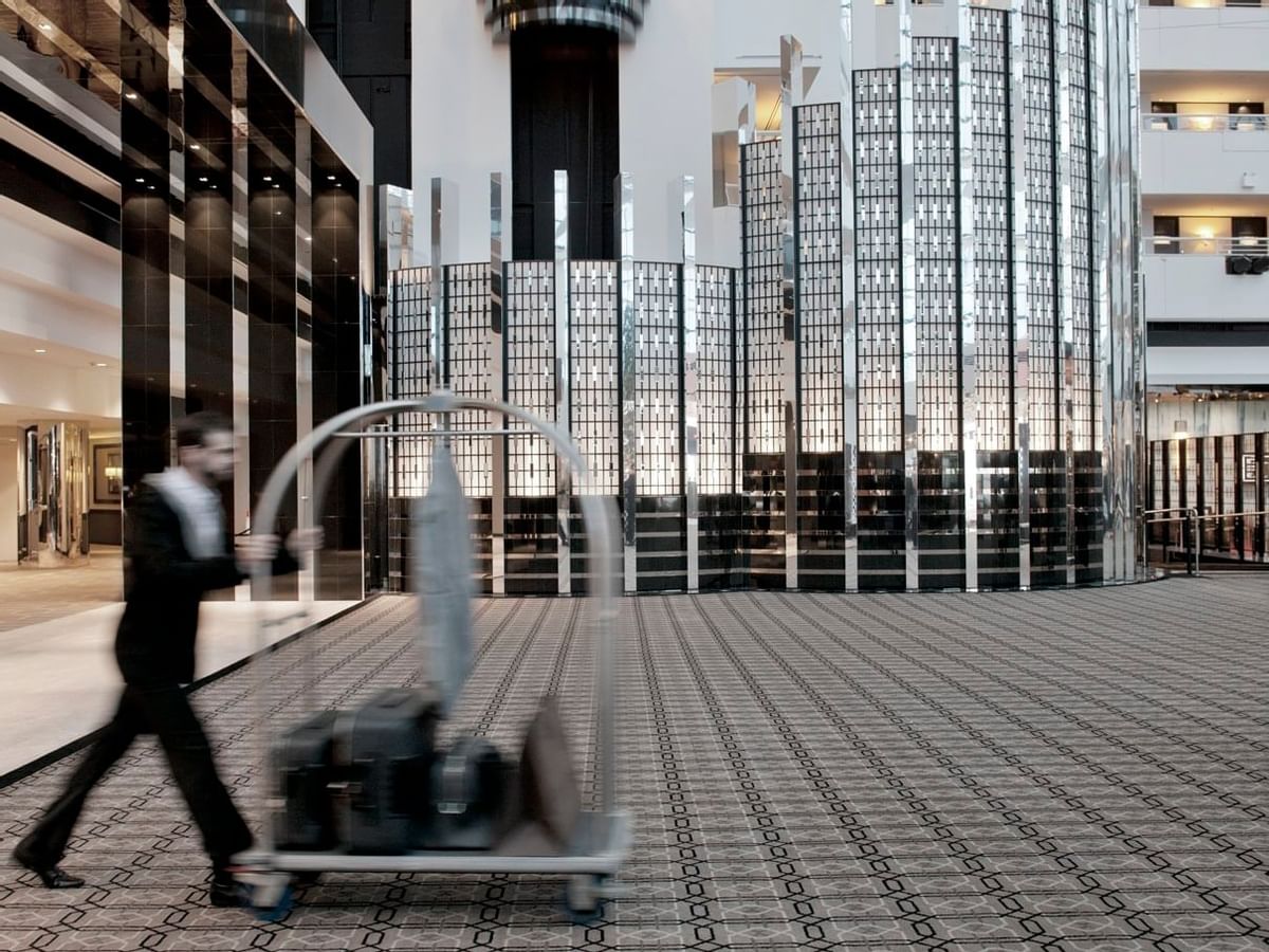 Housekeeper pushing a trolley at Crown Metropol Perth