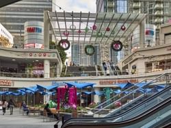 Ground level of the 7th and Figuero shopping center in Los Angeles, CA decorated with holiday wreaths and decorations