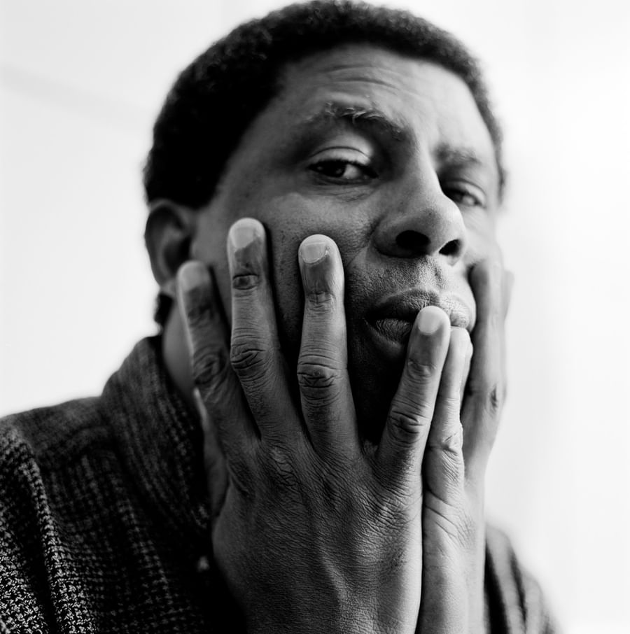 Black and white portrait of a person with hand gently touching their face in a relaxed spa moment at Warwick Le Crystal Montreal