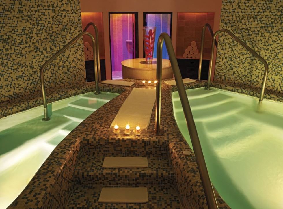 A relaxing indoor pool area in a Spa at Live Aqua Resorts
