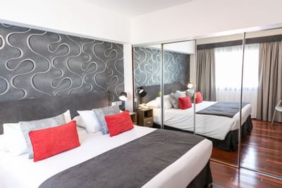 Interior of room with king bed at Argenta Tower Hotel