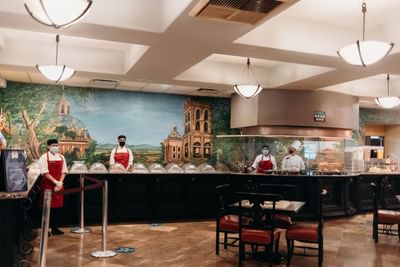 Hotel staff by the buffet, Fonda de Mexicali at Araiza Mexicali