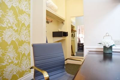 Work desk with a chair in One Bedroom Suite at Courtleigh Hotel & Suites