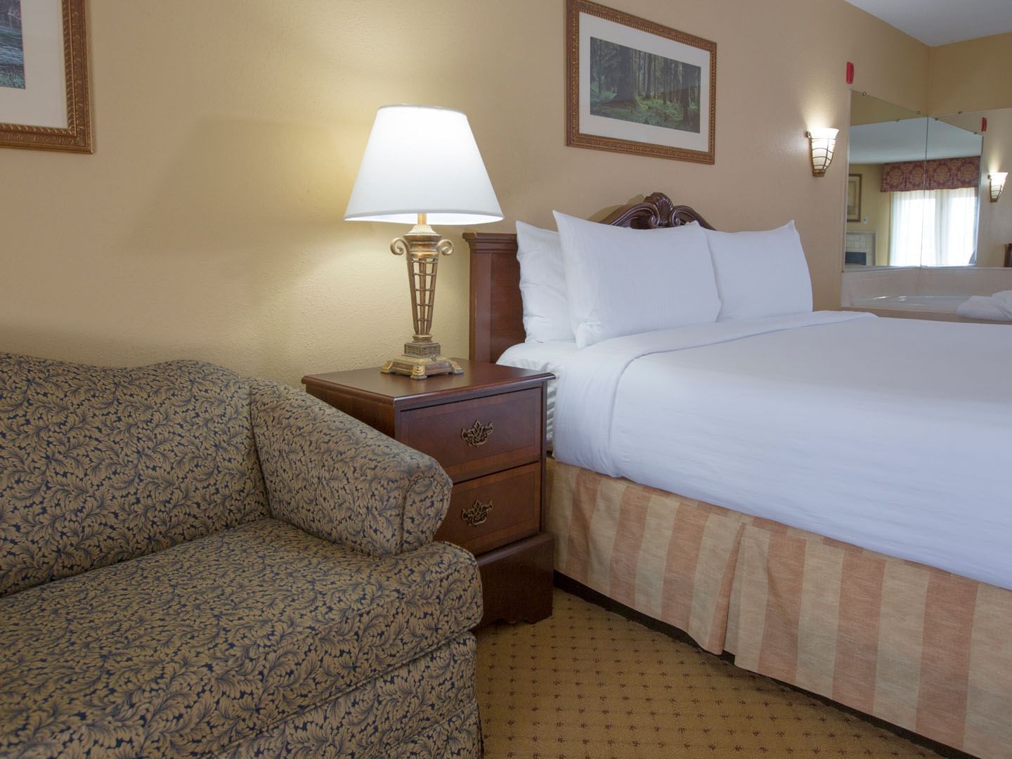 Bedroom arrangement in Premier King Room at Music Road Resort