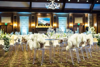 Interior of a wedding hall with white fur chairs at Stein Eriksen Lodge