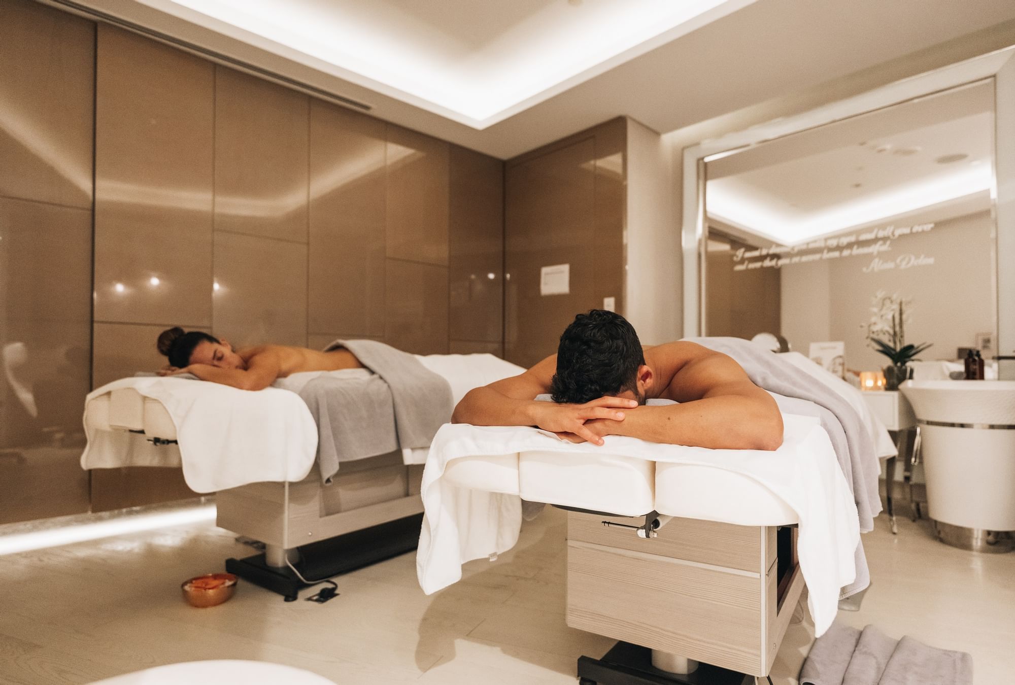 Couple relaxing on massage beds in Pause Spa at Paramount Hotel Dubai