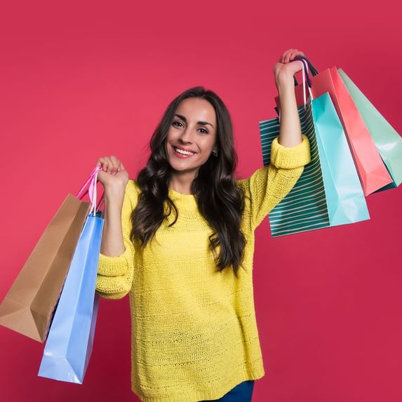 A girl holding shopping bags