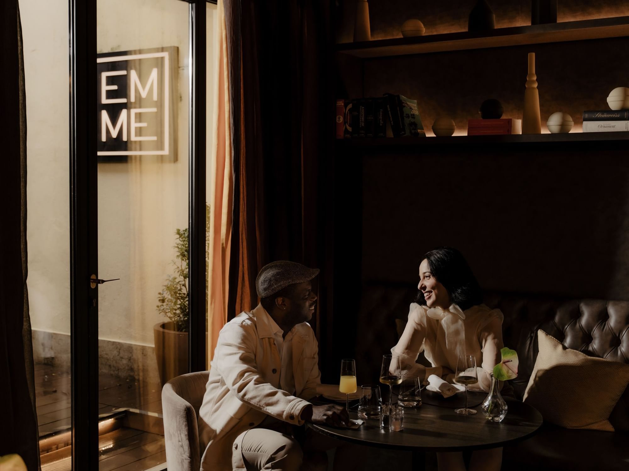 Couple enjoying cocktails in Emme Restaurant at Margutta 19