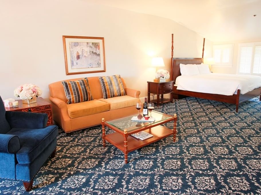 room with bed, sofa and accent chair
