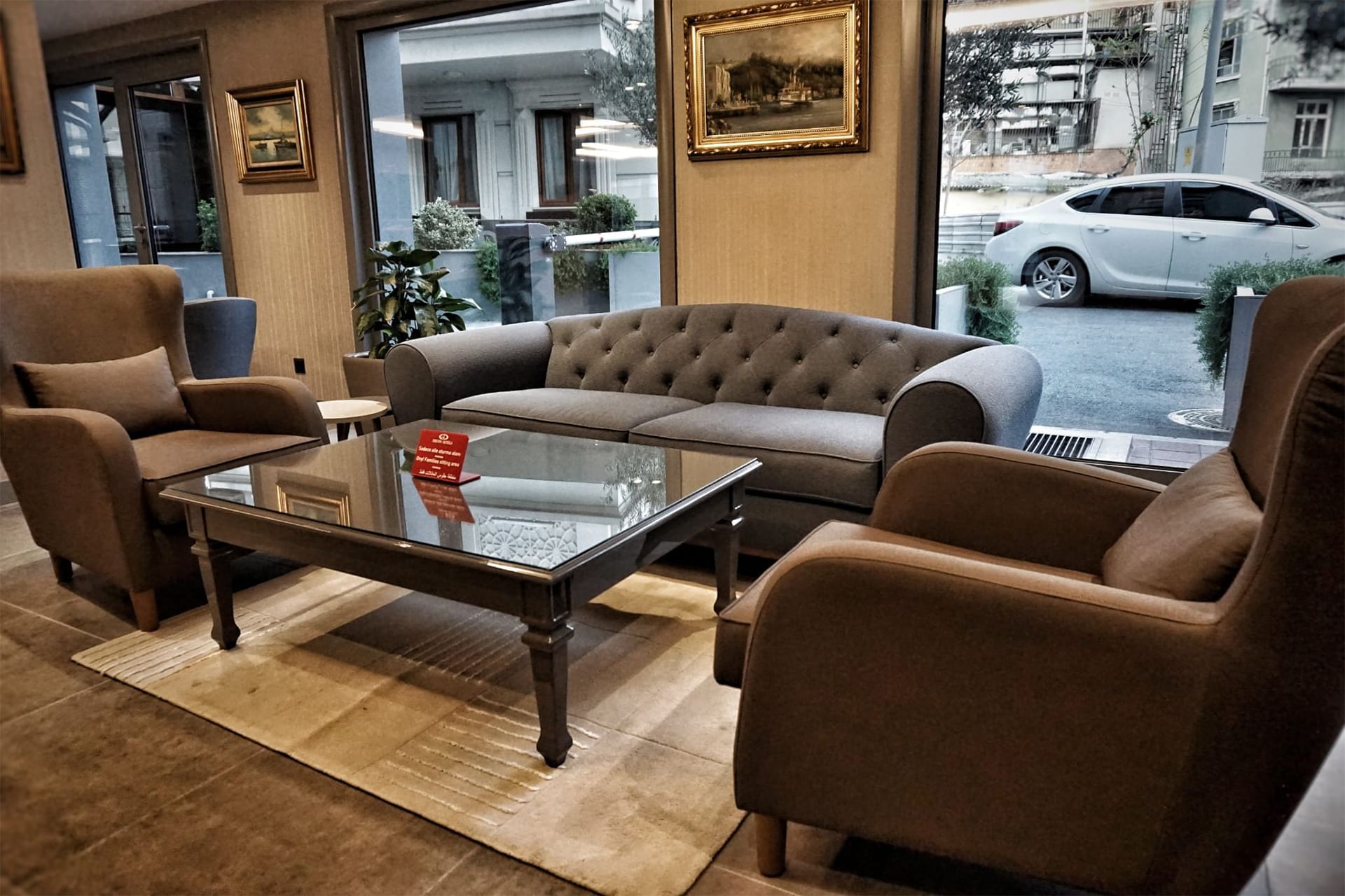 Couch, coffee table & wing chairs in the lobby at Eresin Hotels