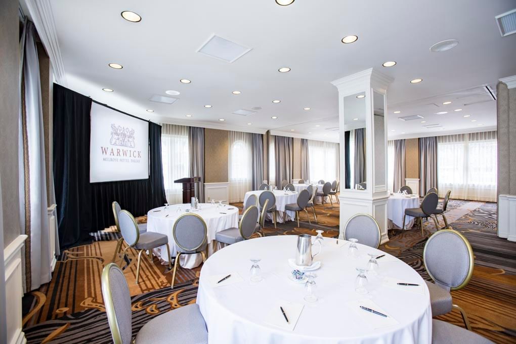 Banquet tables set-up for an event at Warwick Melrose Dallas