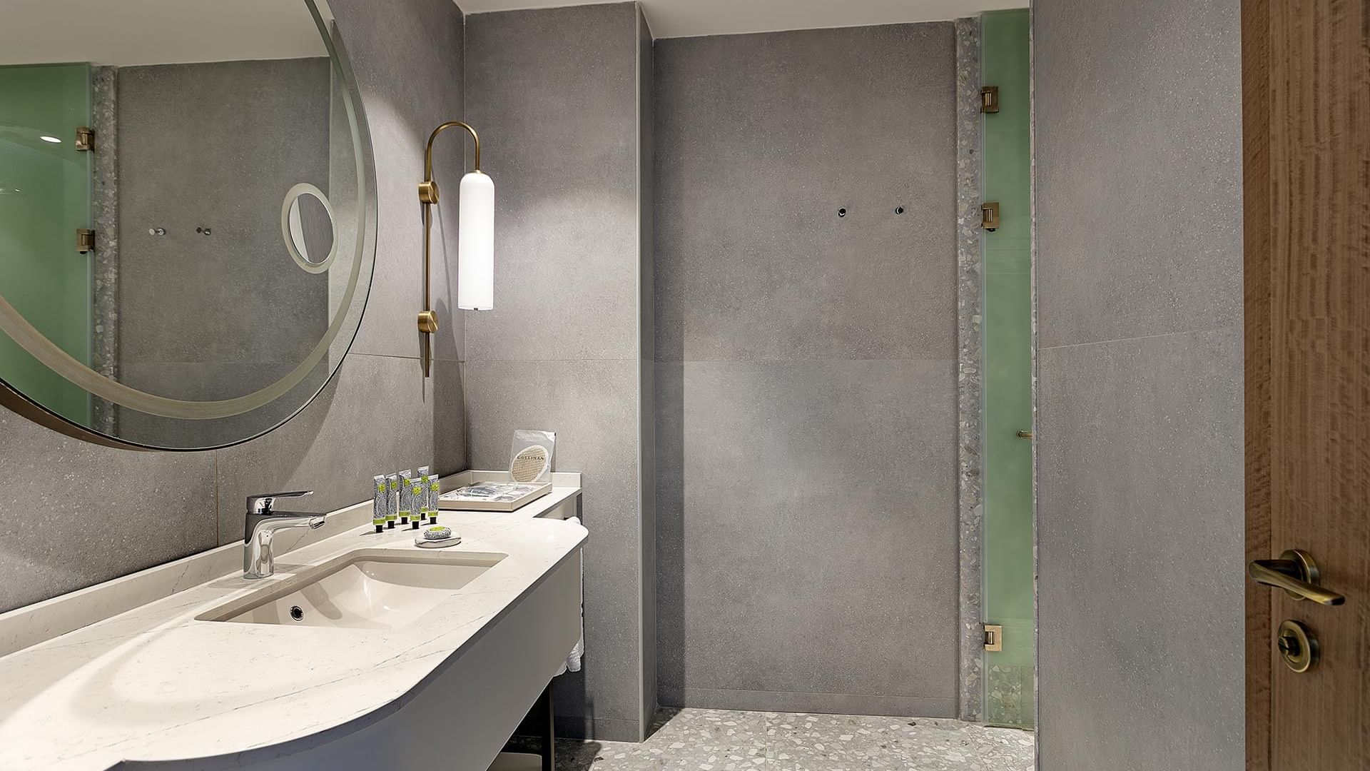 Interior of the bathroom with vanity and a mirror in the Family Duplex at Cullinan Belek