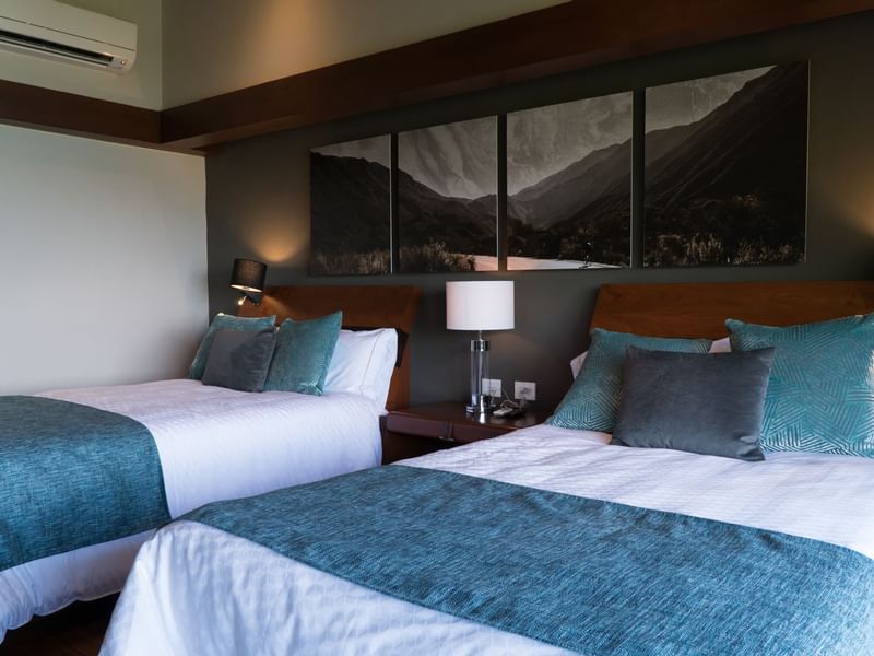 Two beds & night lamps
in Deluxe Villa at Gamma Hotels