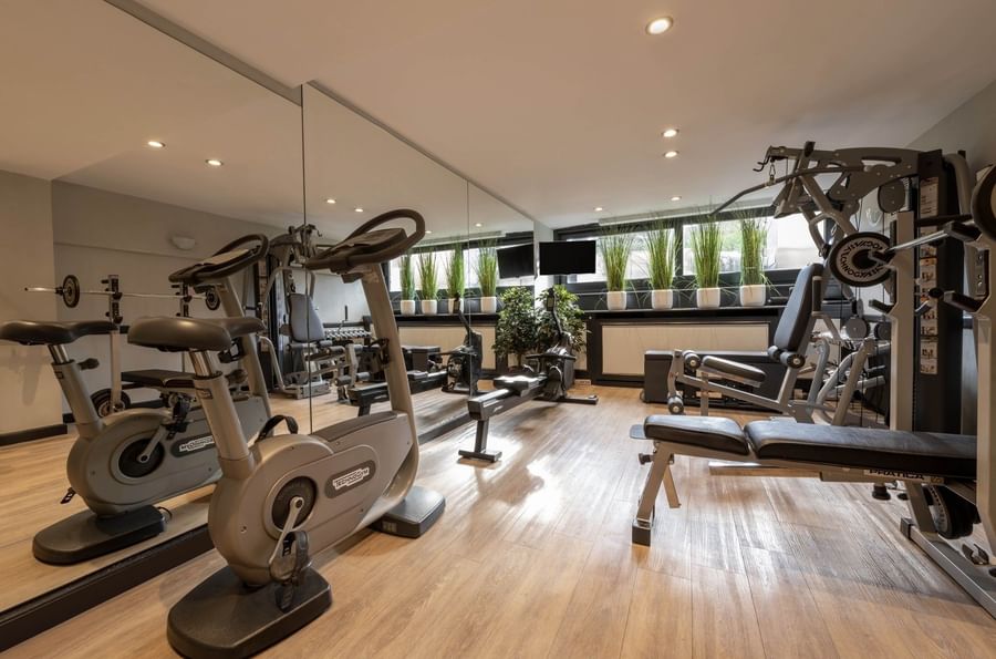 Modern fitness center with rowing machines and cardio gear at Hotel Barsey