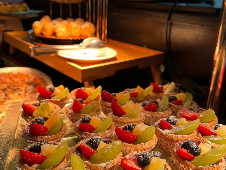 Close-up of fruit cupcakes displayed on a buffet breakfast table in Maya Brasserie at Hotel Maya Kuala Lumpur City Centre