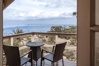 Balcony outdoor seating and sea view at Banning House Lodge