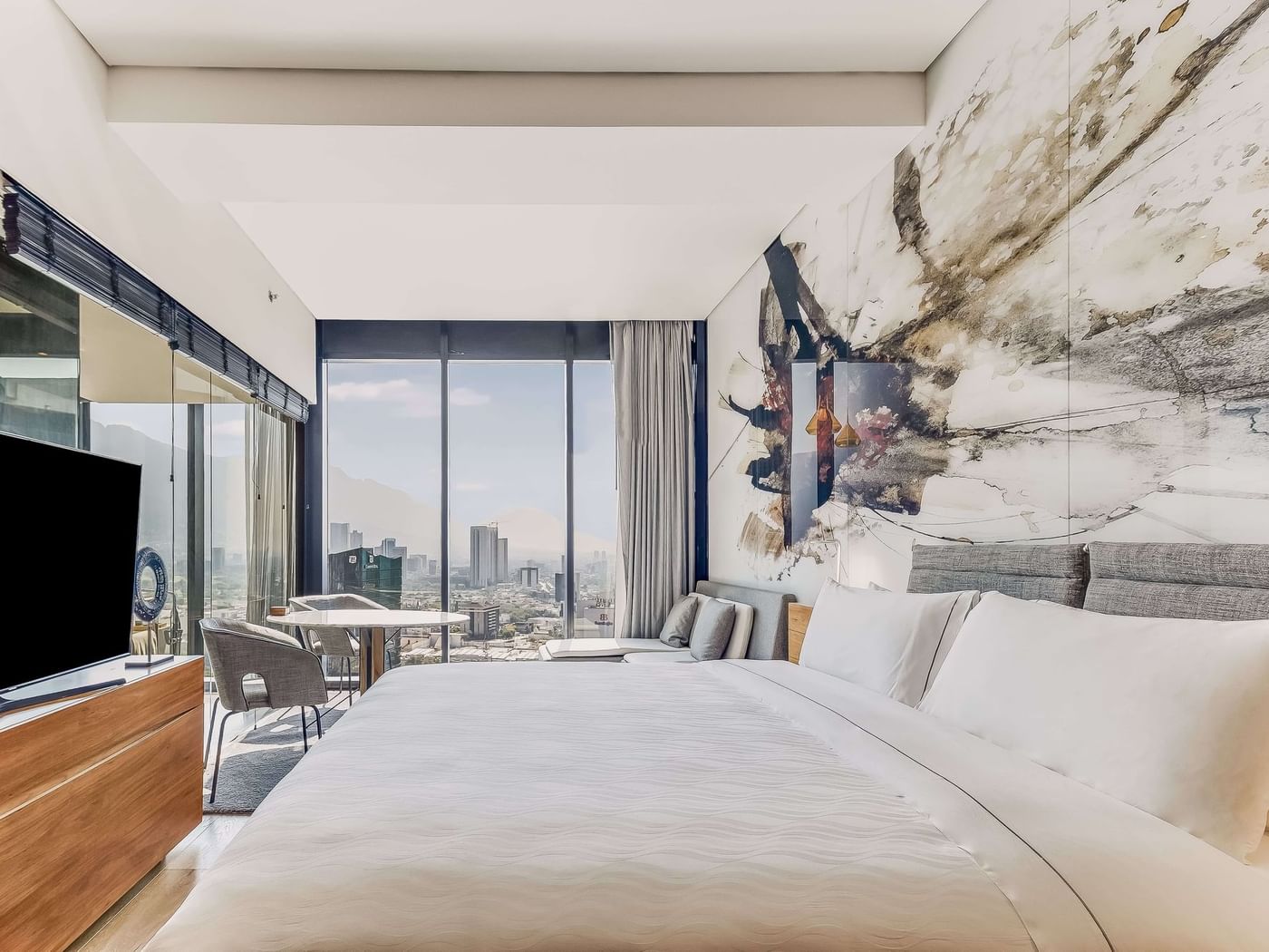 Modern interior of Master Suite with twin bed and TV at FA Hotels & Resorts