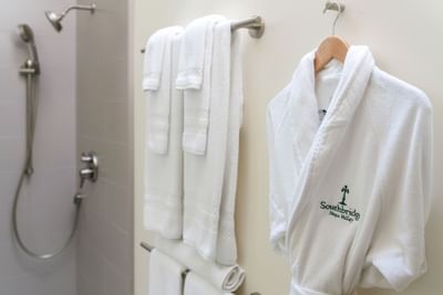 Shower, towels and Southbridge logo robe
