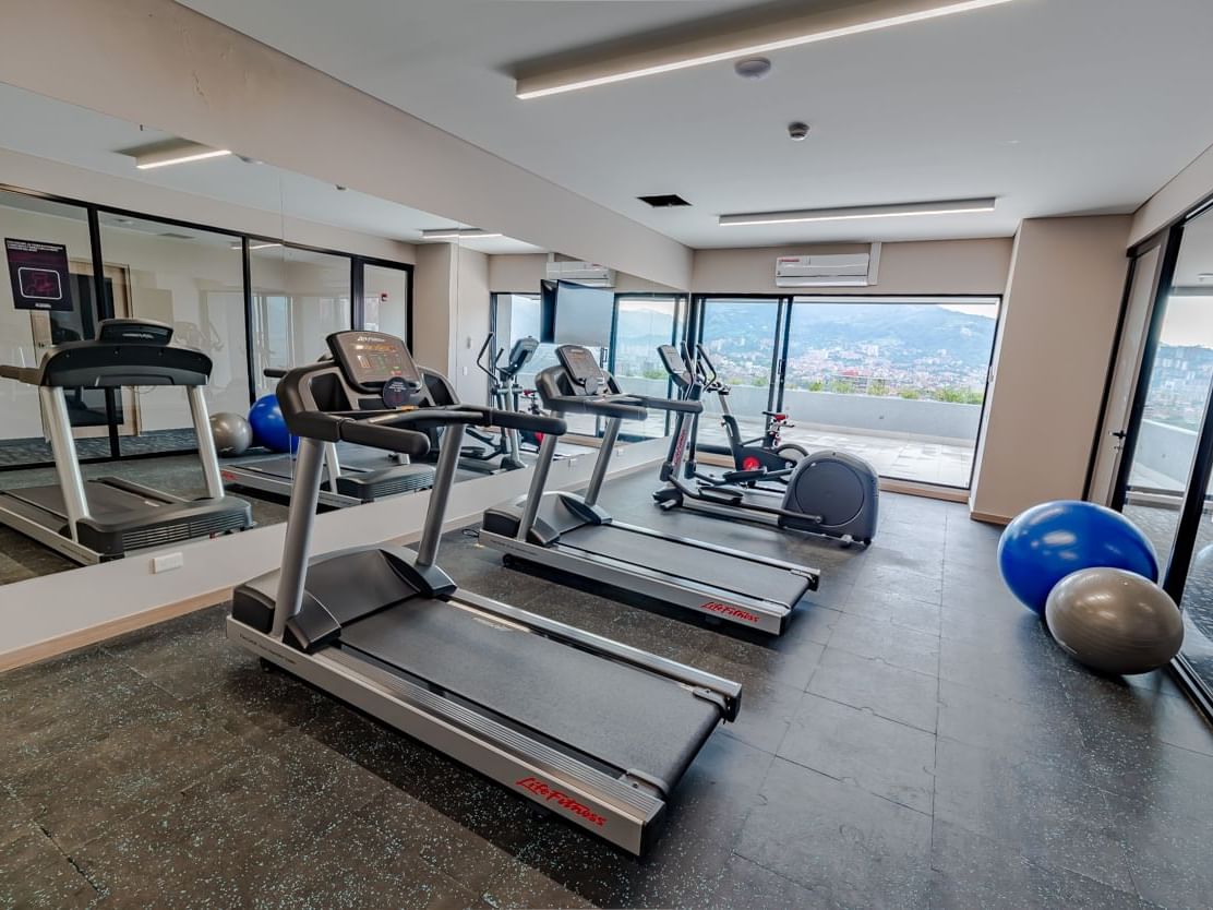 Exercise machines in the fitness center at Blue Doors Hotels