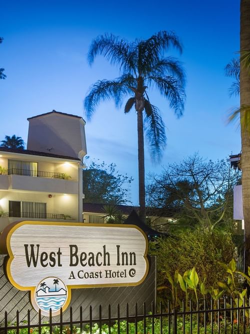 Sign for West Beach Inn, a Coast Hotel