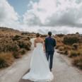 Wedding couple walking on a road near Cradle Mountain Hotel 