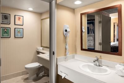 Bathroom vanity area with lavatory in Suite at Anaheim Portofino Inn & Suites