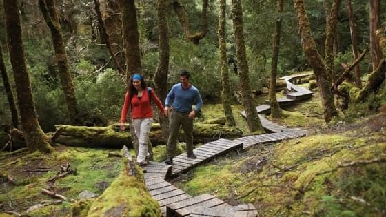 Couple walking on the trails near Cradle Mountain Hotel 