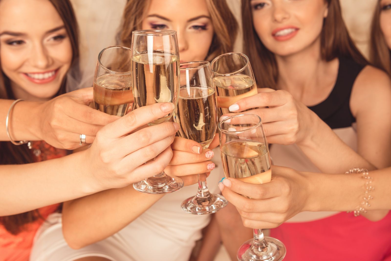 Group of girls toasting with champagne at Carriage House Hotel
