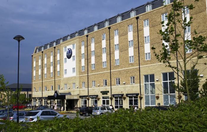 An exterior view of the hotel & car park at Village Hotels