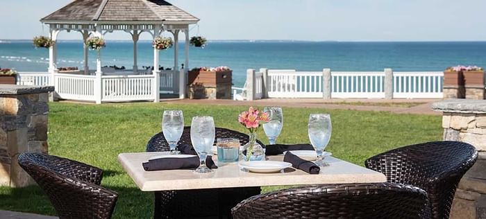 Outdoor dining & lounge area overlooking the sea at Ogunquit Collection