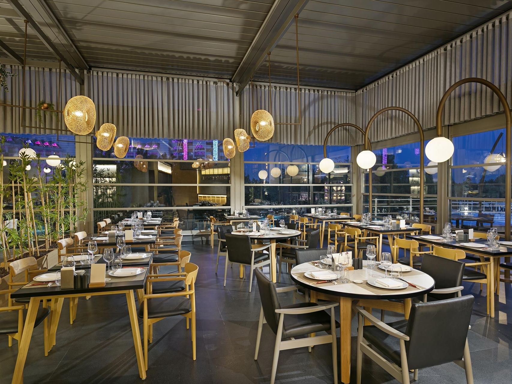 Large dining hall with tables and chairs in Nori Japanese Restaurant at Titanic Deluxe Lara