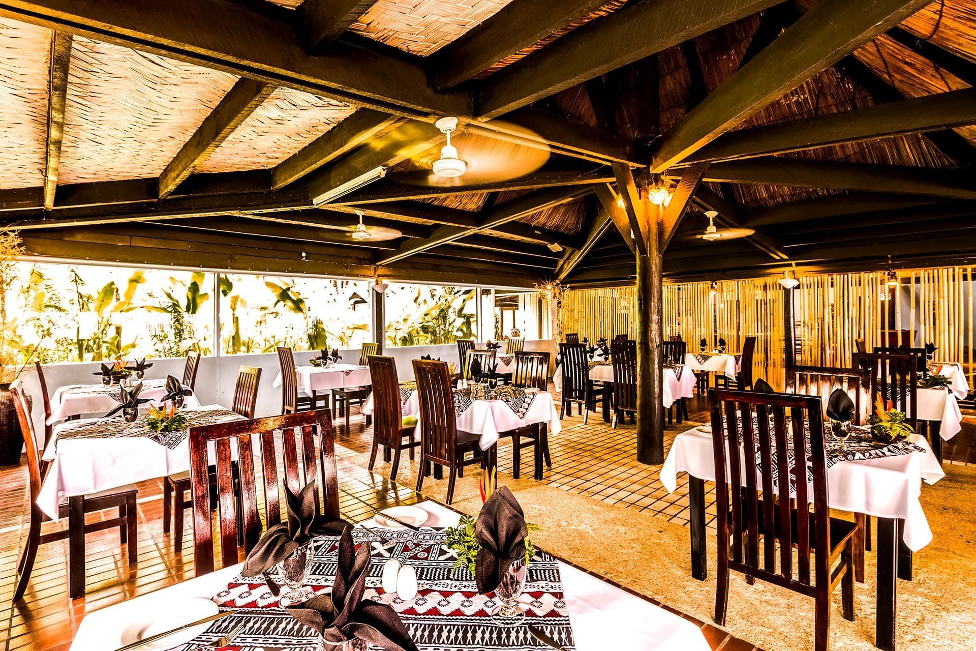 Table set-up in a restaurant at Tambua Sands Beach Resort