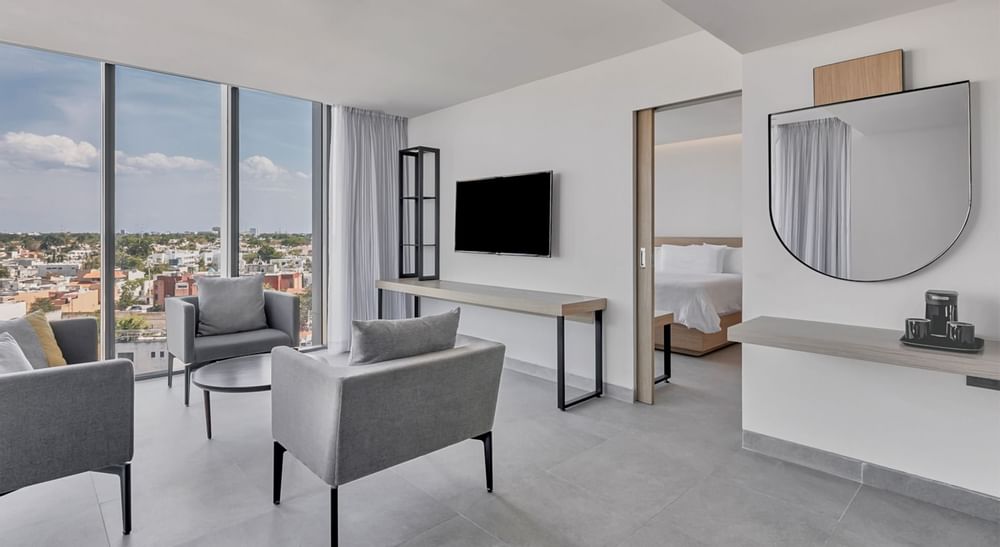 Lounge area overlooking city in a Suite at IOH Freestyle Hotels