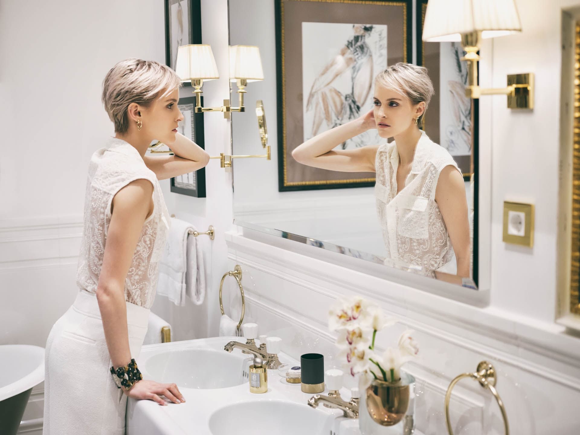 Model posing in the bathroom at Patrick Hellman Schlosshotel