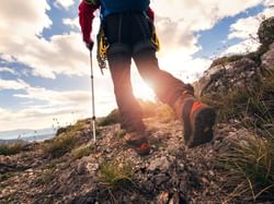 Traveler feet hiking in mountains near Hoteles Australis