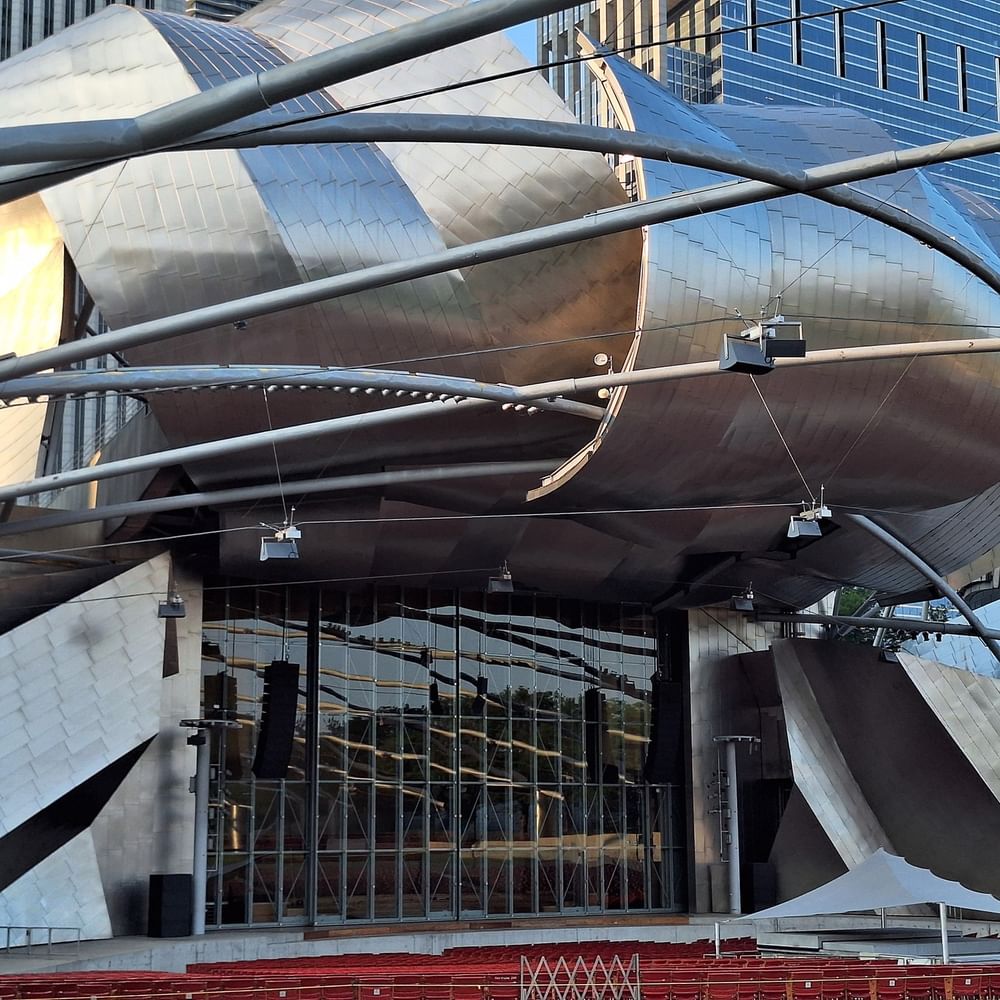 Modern architectural building exterior with red seats at Warwick Allerton - Chicago.