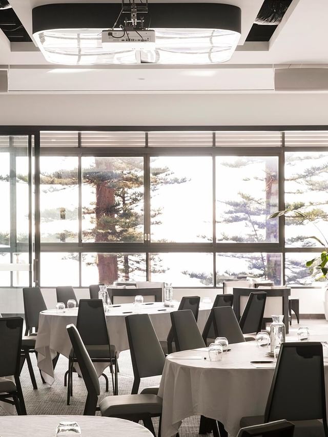 Pacific Ballroom at Elysium Manly with tables and many grey chairs around, a premier Manly event venue