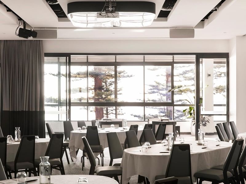 Pacific Ballroom at Elysium Manly with tables and many grey chairs around, a premier Manly event venue