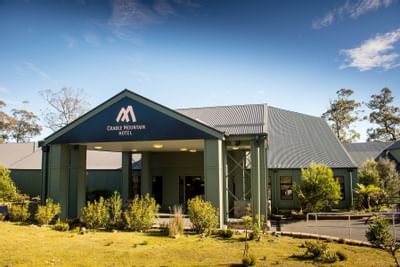 Exterior view with the garden at Cradle Mountain Hotel