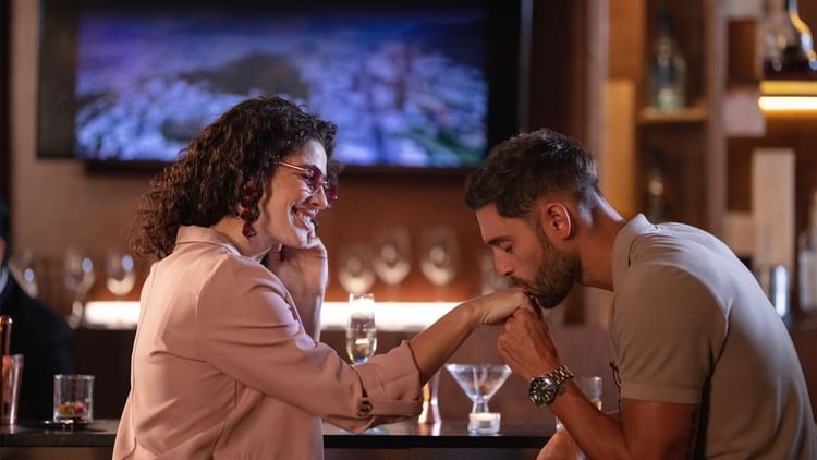 Couple shares an intimate moment at a bar in Live Aqua Monterrey