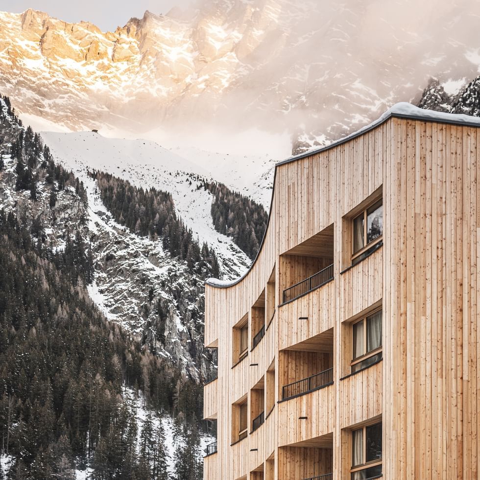 Falkensteiner Hotel Antholz exterior with snowy mountains