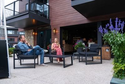 Couple enjoying drinks on the lounge patio