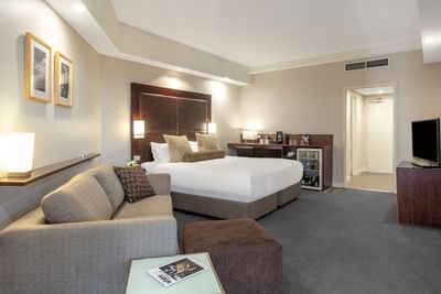 Living area in Deluxe Courtyard King at Amora Hotel Melbourne