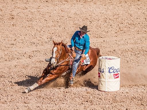 Man riding a horse in Jackson Hole Rodeo near Hotel Jackson