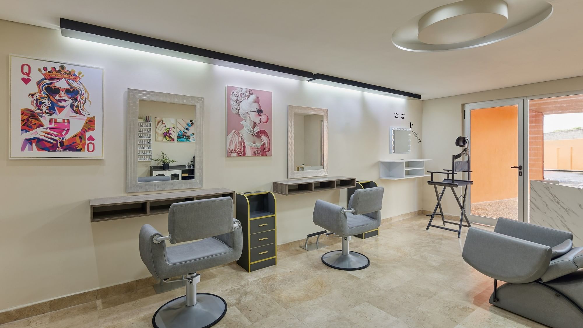 Three hair salon chairs and mirrors in a salon at Grand Fiesta Americana Veracruz.