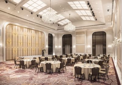 Cabaret type tables arranged in an Event Hall with carpeted floors at Eastin Hotels