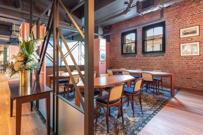 Lobby work space & brick wall interior at Amora Hotel Melbourne